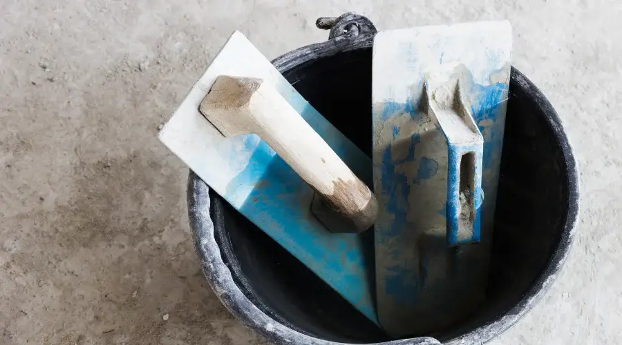 masonry tools in a bucket